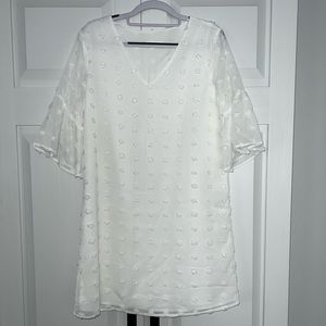White bell sleeve polka dot dress.
